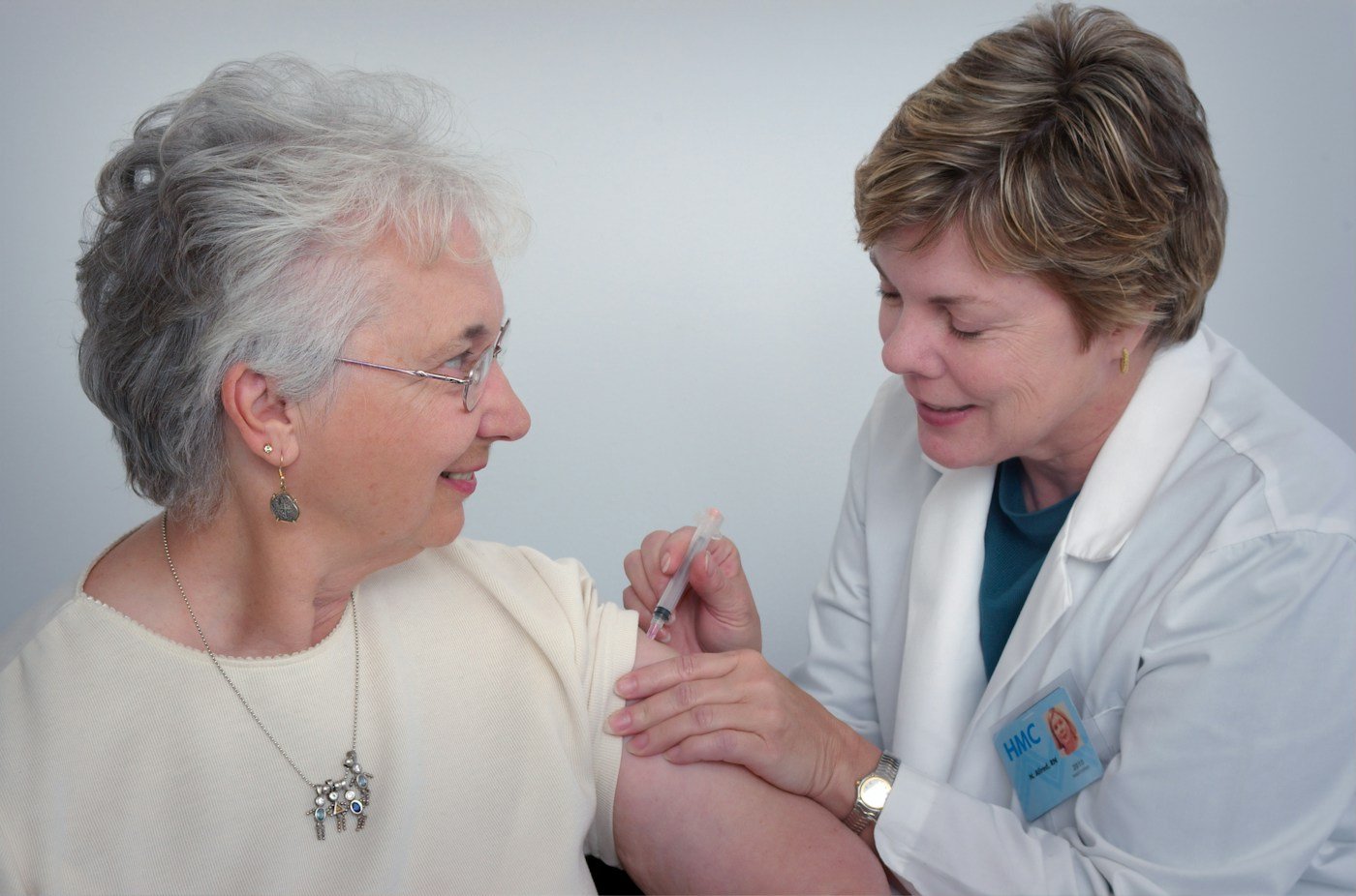 Compassionate healthcare physician conducting consultation with senior Medicare patient